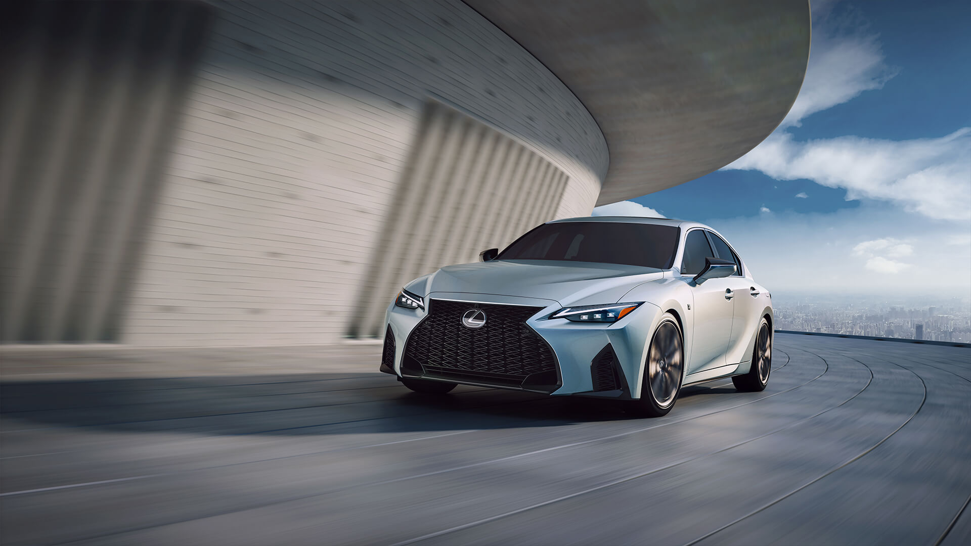 Silver Lexus IS being driven on a winding path.