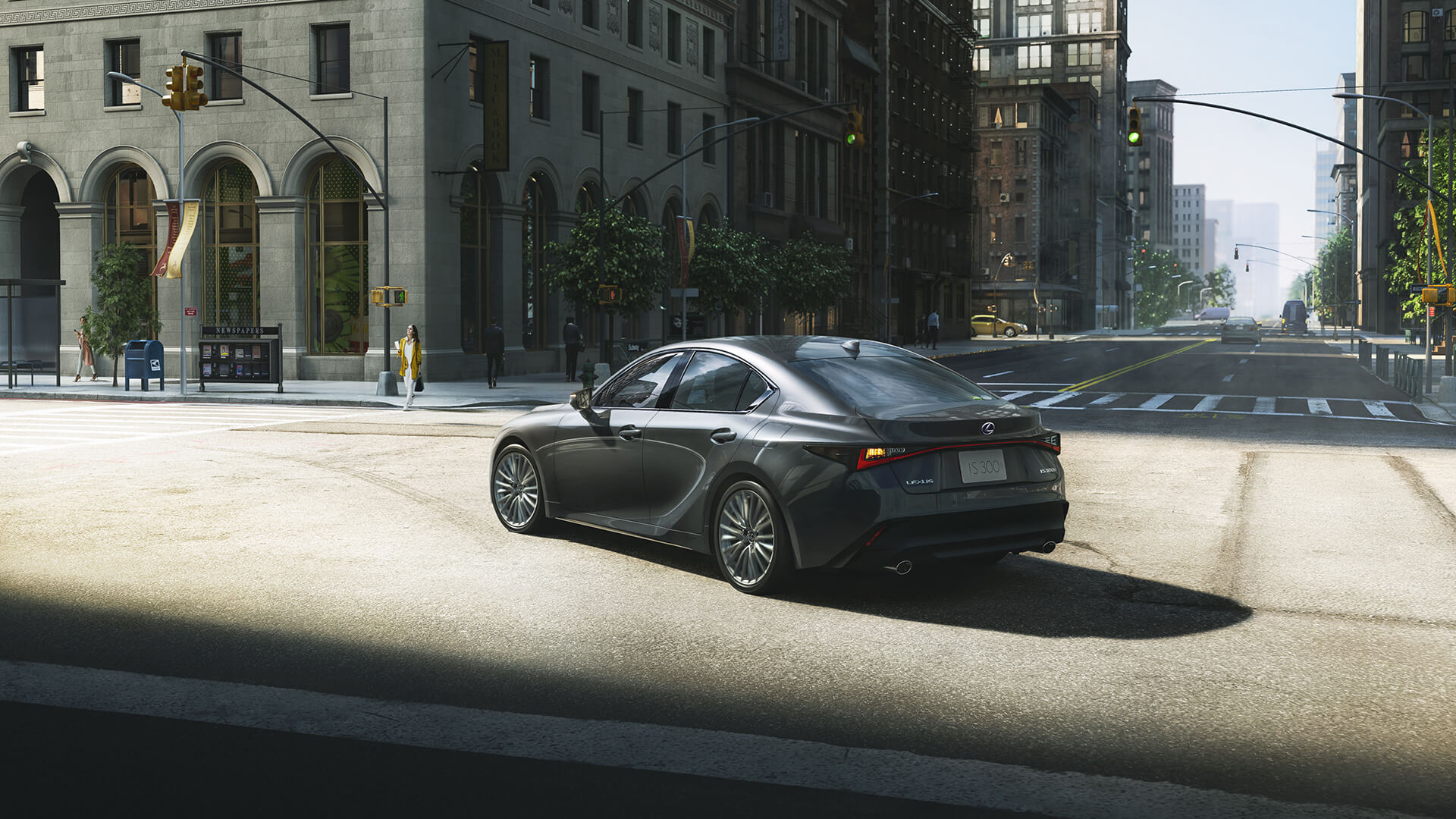 Black Lexus IS being driven in a city.