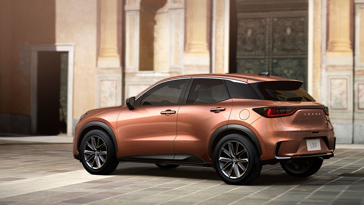 Elegant Sonic Copper Lexus LBX SUV in architectural backdrop showcasing sleek design and superior hybrid technology.